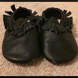 Black fringe moccasins